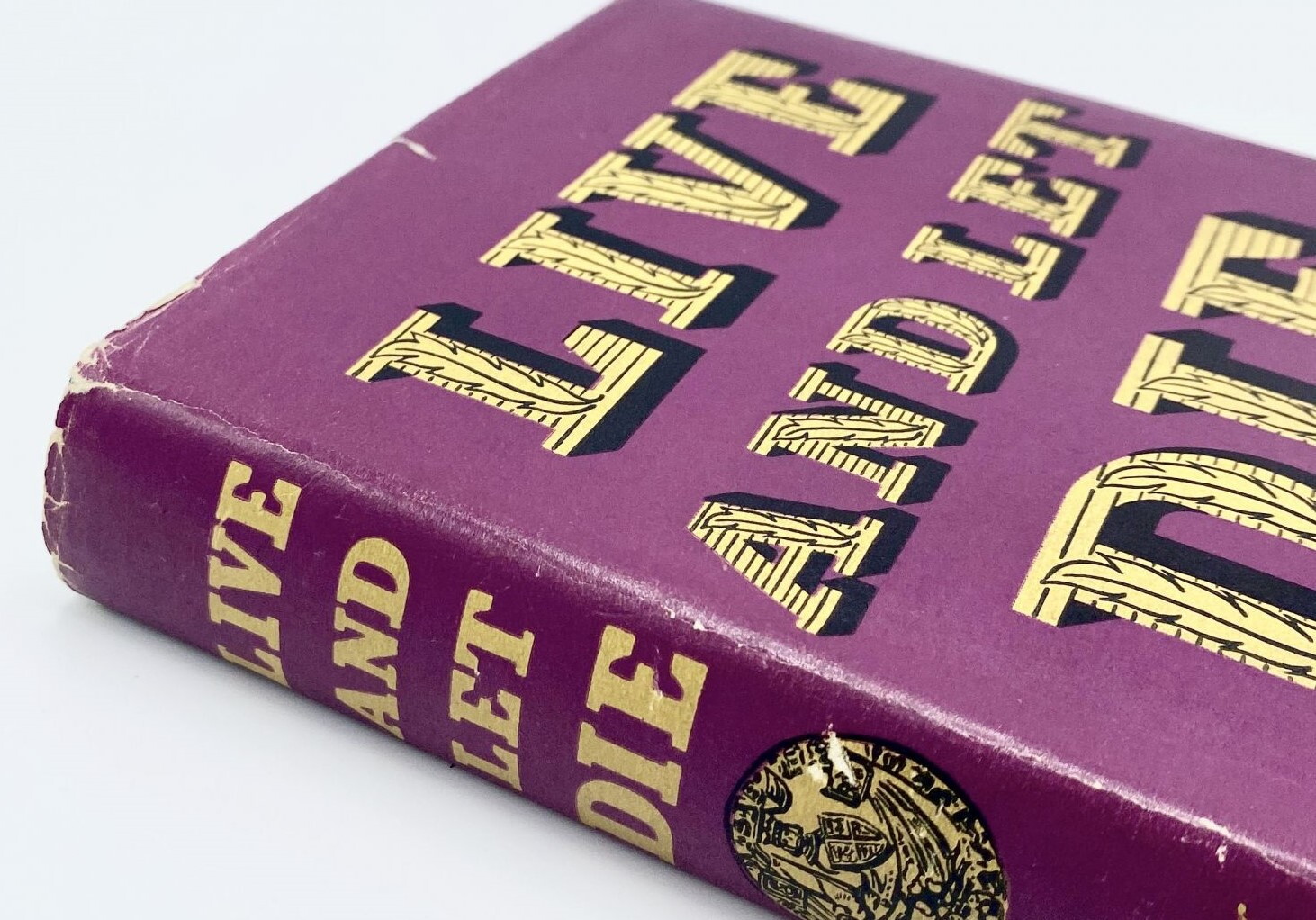 A page from a leather-bound book shows a gold ribbon and a printed note indicating that this edition of "Schindler's List" is signed by Thomas Keneally, with his signature in blue ink.
